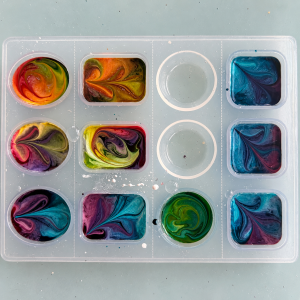 Alcohol Ink resin pendants from the back while curing.